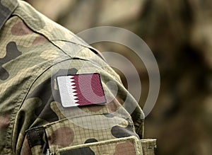 Flag of Qatar on military uniform collage photo