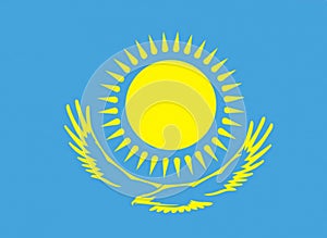 The flag of the Republic of Kazakhstan of the sun and a flying bird in yellow on a blue background