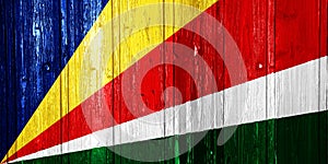 Flag of Republic of Seychelles on a textured background. Concept collage