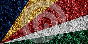 Flag of Republic of Seychelles on a textured background. Concept collage