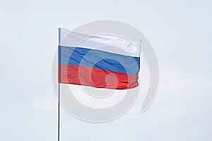 Flag of Russia against the sky. Celebration of the Independence Day of Russia on June 12