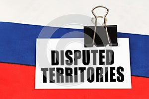 On the flag of Russia there is a business card with the inscription - Disputed territories