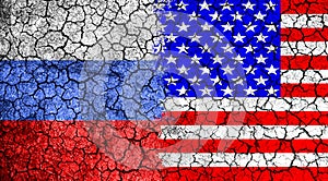 Flag of Russia and USA painted on the cracked wall. Concept of war. Cold war. The arms race. Nuclear war.