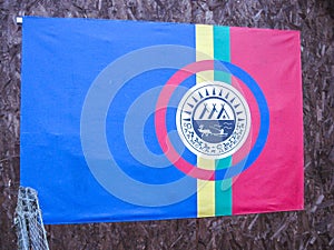 Flag of the Sami nation located in saami village Lovozero on the Kola Peninsula, Russia. on the flag written in Russian and sami