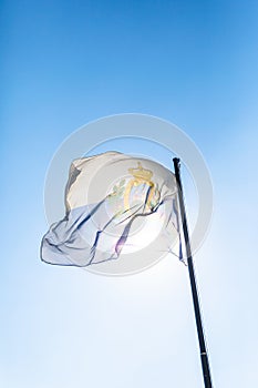 Flag of San Marino in front of blue sky