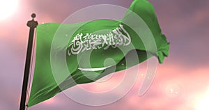 Flag of Saudi Arabia waving at wind at sunset, loop