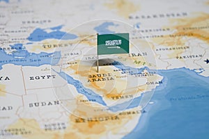 The Flag of saudi arabia in the world map photo