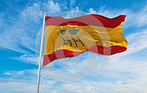 flag of Servicio de Vigilancia Aduanera , Spain at cloudy sky background on sunset, panoramic view. Spanish travel and patriot photo