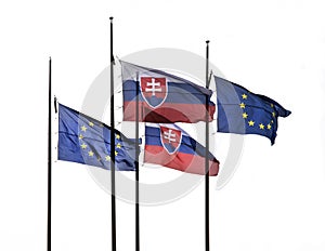 The flag of Slovakia and European Union flying on the flagpole