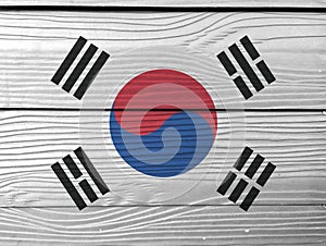 Flag of South Korea on wooden wall background. Grunge South Korea flag texture. photo