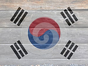 Flag of South Korea on wooden wall background. Grunge South Korean flag texture. photo
