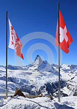 Flag of Switzerland on mountaintop