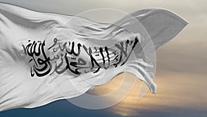 The flag with symbols of the Islamist terrorist movement flies against the background of the dark sky with clouds. Shahada is writ