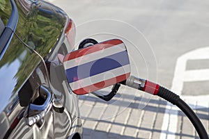 Flag of Thailande on the car`s fuel filler flap.
