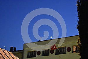 The flag of the Turkey and the crescent in the night sky above