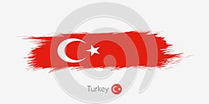 Flag of Turkey, grunge abstract brush stroke on gray background