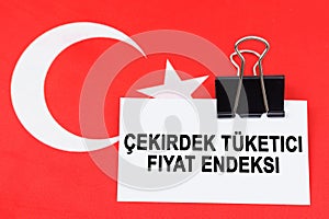 On the flag of Turkey lies a business card with the inscription - core consumer price index.