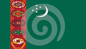 Flag of Turkmenistan. Turkmen flag on fabric surface. Fabric texture