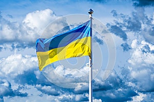 Flag of Ukraine against the background of a cloudy sky