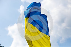 Flag of Ukraine against the blue sky. Horizontal shot.