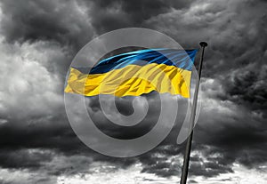 Flag of Ukraine against dramatic sky