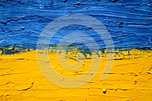 Flag of Ukraine on old grunge wall in background.