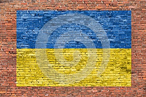 Flag of Ukraine painted over brick wall