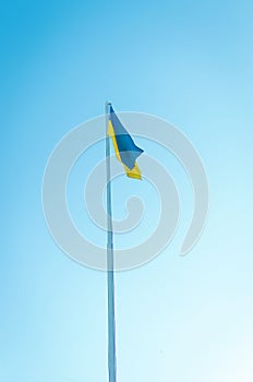 flag of Ukraine on a pole against the sky