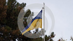The flag of Ukraine is waving in the wind.