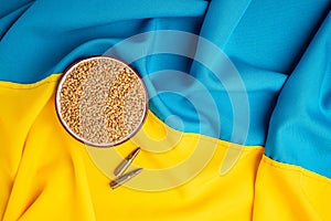 flag of Ukraine with wheat spikelets. Stop the war. Concept of food supply crisis and global food scarcity. place for text, top