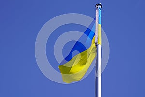 Flag ukrainian National country state flag of Ukraine banner on white matin liberty  blue sky photo