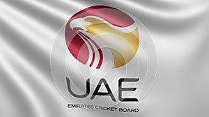 The flag of the United Arab Emirates cricket board cricket flutters in the wind close-up, the flag of the UAE cricket