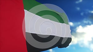 Flag of United Arab Emirates UAE waving at wind against beautiful blue sky