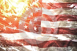 Flag United States America against background burning flames and embers