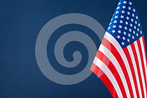 The flag of the United States of America against blue background with copy space