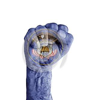 Flag of US Utah state painted on human fist like victory symbol