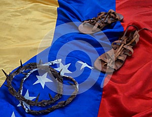 Flag of Venezuela with the crown and sandals of Jesus Christ. photo