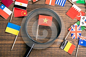 Flag of Vietnam. Flags of many countries, magnifying glass on table