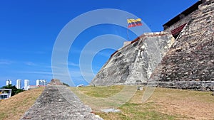 Flag wavering in front of Castle of Saint Philippe, Castillo San Felipe de Barajas. Scenic view of Cartagena modern