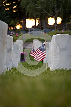 Flag waving at Military cemetery on Memorial Day