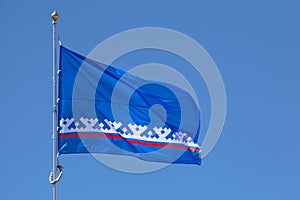 Flag of Yamalo-Nenets Autonomous Okrug waving atop of its pole