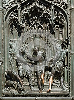 Flagellation of Christ, detail of the main bronze door of the Milan Cathedral, Duomo di Santa Maria Nascente, Milan, Italy