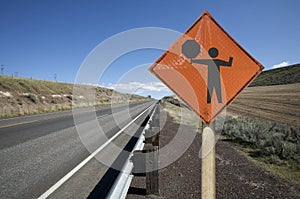 Flagger construction sign