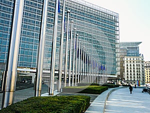 Flagpoles and the Berlaymont building in Brussels photo