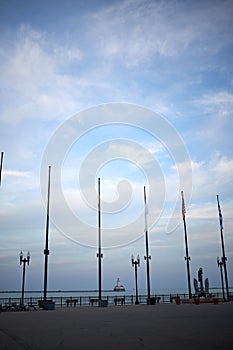 Flagpoles, lamps and an anchor on the navy pier