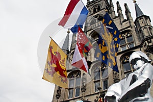Flags on the ancient town hall at the Markt of Gouda during celebration of 750 years Gouda