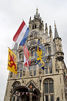 Flags on the ancient town hall at the Markt of Gouda during celebration of 750 years Gouda