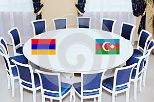 Flags of Azerbaijan and Armenia at the round table. The truce of the warring parties or diplomatic negotiations