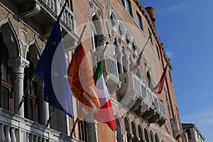 Flags on the background of buildings in Venice, Italy