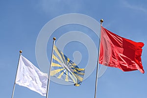 Flags on the blue sky. Symbol of the national country. Emblem on the state background.